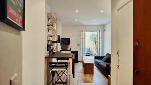 a living room with a bar and a couch at Appartement maison Jeanne by Booking Guys in Nice