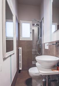 a bathroom with a sink and a toilet and a shower at Apartments Florence - Pinzochere White in Florence