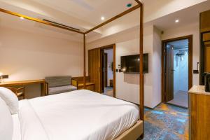 Giường trong phòng chung tại Avana- A Boutique Hotel