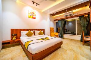 a bedroom with a large bed in a room at CanvaSand By Eease Hospitality in Nagaon