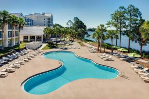 an aerial view of the pool at the resort with lounge chairs at Bluegreen's Bayside Resort and Spa at Panama City Beach in Panama City Beach