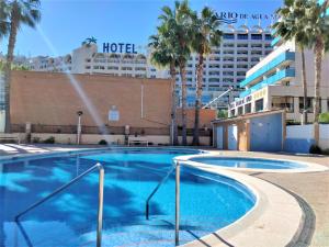 a large swimming pool in front of a hotel at ACV Primera Línea in Oropesa del Mar