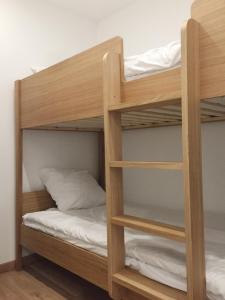 Posteľ alebo postele v izbe v ubytovaní Appartement Familial Au Coeur du Marais