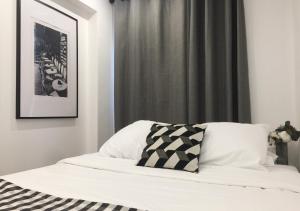 Posteľ alebo postele v izbe v ubytovaní Appartement Familial Au Coeur du Marais