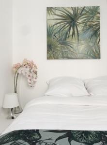 Posteľ alebo postele v izbe v ubytovaní Appartement Familial Au Coeur du Marais