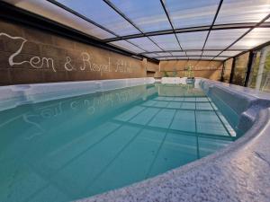 a large swimming pool with a clear blue water at Sérénité - Espace Détente Ensival in Ensival