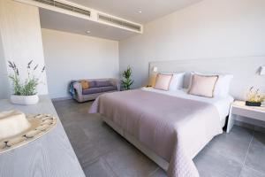 Posteľ alebo postele v izbe v ubytovaní Porto Bello Beach Hotel