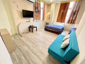a living room with a couch and a tv at Happy Holiday Xiaoliuqiu in Xiaoliuqiu