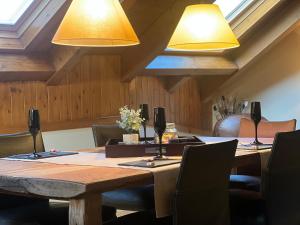 a conference room with a wooden table and lights at Boren Deluxe in Boren