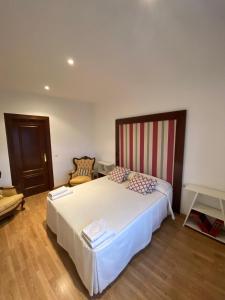 Llit o llits en una habitació de Ático dos dormitorios en el centro de Córdoba