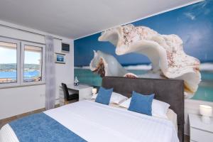 Postel nebo postele na pokoji v ubytování Holiday Villa Perna