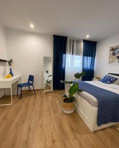 Postel nebo postele na pokoji v ubytování Hostal Orange Vibes