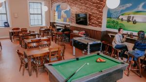 a room with a pool table in a restaurant at Gardiner House in Dublin