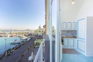 a balcony with a view of a marina at TORRETTA CORRICELLA - Punta Miseno in Procida