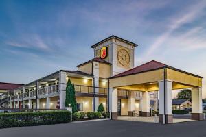 a building with a clock tower on top of it at Super 8 by Wyndham Columbia in Columbia