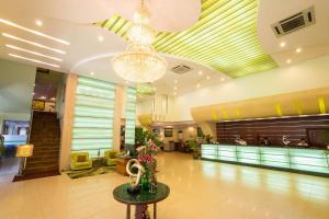 a lobby of a hotel with a chandelier at Best Western Green Hill Hotel in Yangon