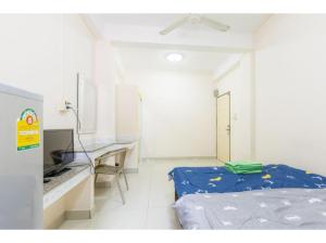 Cama o camas de una habitación en OYO 75405 Ladda Place