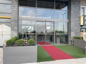 a red carpet in front of a building at AGORA ROYAL HOTEL in Esenyurt