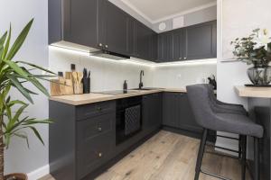 Kuchyňa alebo kuchynka v ubytovaní Gdynia Plac Unii Śródmieście Apartment by Noclegi Renters