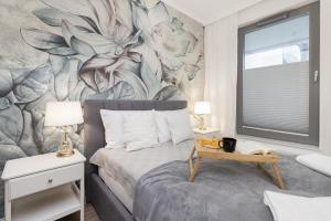 Posteľ alebo postele v izbe v ubytovaní Gdynia Plac Unii Śródmieście Apartment by Noclegi Renters