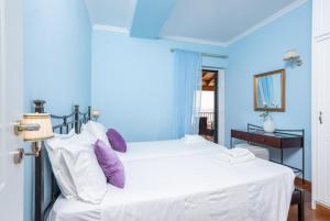 A bed or beds in a room at Villa Magda