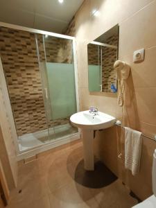 a bathroom with a sink and a shower at Hostal Colkida in Barcelona