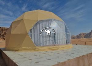 a tent in the middle of the desert at White Desert Camp in Wadi Rum