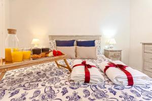 Posteľ alebo postele v izbe v ubytovaní -MalagaSunApts- City Central Tapas&Relax