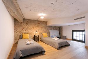 Posteľ alebo postele v izbe v ubytovaní -MalagaSunApts-Industrial Loft CityCentre