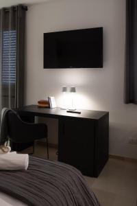 TV a/nebo společenská místnost v ubytování Suite1212 - Rattazzi