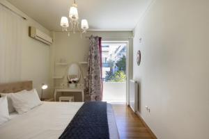 Posteľ alebo postele v izbe v ubytovaní 3BR Prime APT a breath away from the Acropolis!