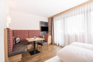 Postel nebo postele na pokoji v ubytování Hotel Augarten