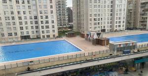 an overhead view of a large swimming pool in a city at AGORA ROYAL HOTEL in Esenyurt