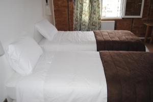 Postel nebo postele na pokoji v ubytování Chocolate Manor House Hotel Boutique