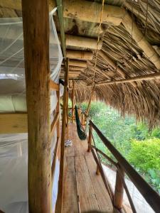 a wooden structure with a canopy over the top of it at The Journey Hostel in Los Naranjos