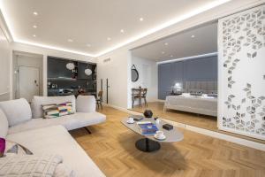 a living room with a couch and a table at Chic central Athens apartment at Mavilli Sq. in Athens