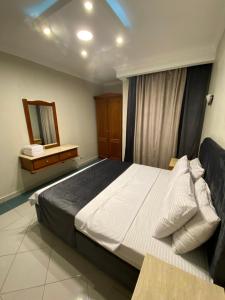 A bed or beds in a room at Delta Sharm 205