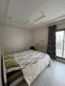 Ein Bett oder Betten in einem Zimmer der Unterkunft Agréable et Spacieux appartement 1min de la plage