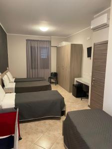 Ένα ή περισσότερα κρεβάτια σε δωμάτιο στο B&B Menna Vence