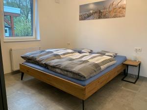 Postel nebo postele na pokoji v ubytování Ankerplatz Ferienhaus Sehestedt