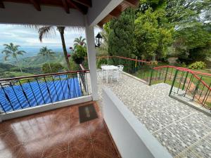 a balcony with a view of a swimming pool at El Gran Mirador in Buenavista