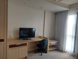 Lets Idea Hotel Flat Particular的电视和/或娱乐中心