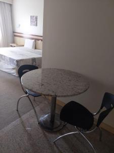 Lets Idea Hotel Flat Particular客房内的一张或多张床位