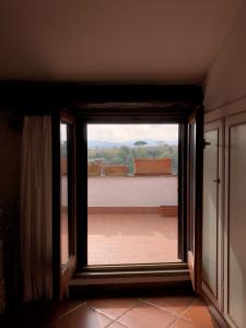 an open door to a balcony with a view at Verso Sud in Sutri