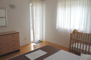 Postel nebo postele na pokoji v ubytování Apartments Kovacic