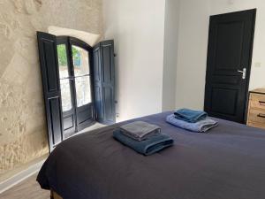 Posteľ alebo postele v izbe v ubytovaní Appartement de standing au cœur d’Avignon