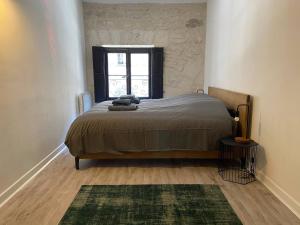 Posteľ alebo postele v izbe v ubytovaní Appartement de standing au cœur d’Avignon