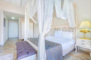 A bed or beds in a room at Alya Villa Butik Hotel