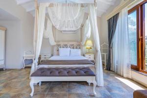 A bed or beds in a room at Alya Villa Butik Hotel