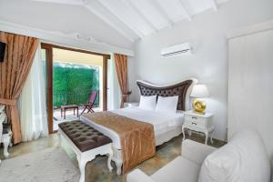 A bed or beds in a room at Alya Villa Butik Hotel